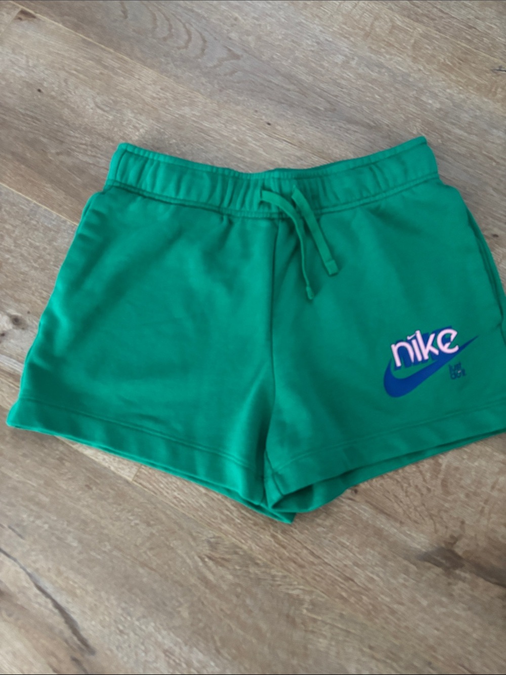 Nike Women's Green Athletic Shorts with Blue Logo